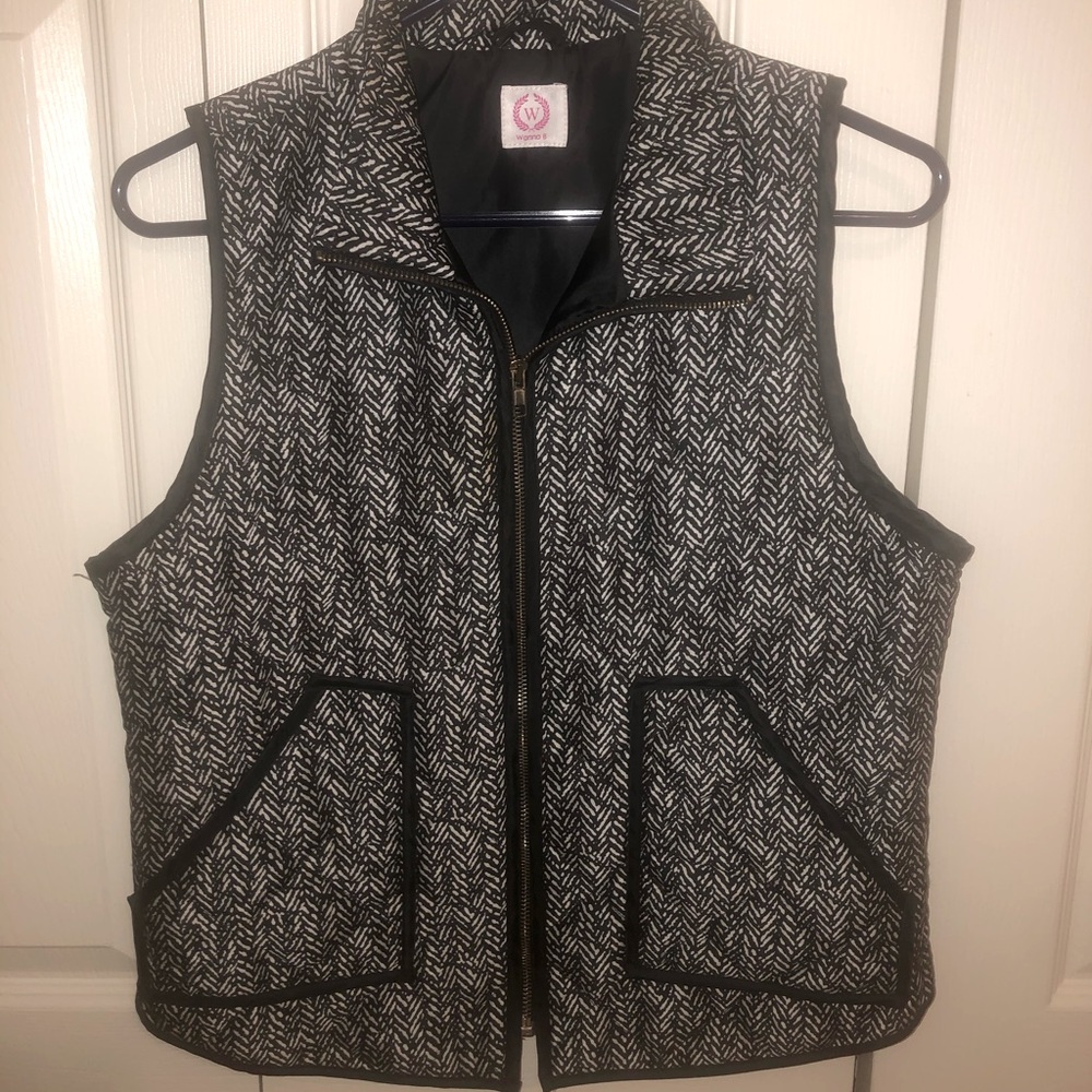 Quilted puffer vest in herringbone pattern.